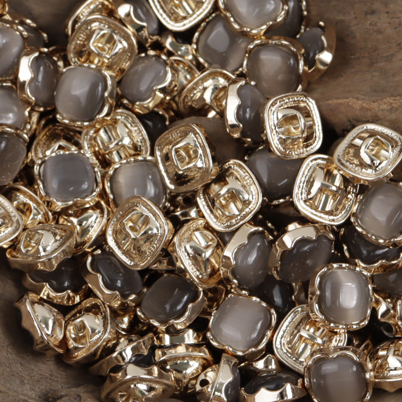 Charcoal gray jade-colored metal shank buttons with gold-tone square settings, 10mm