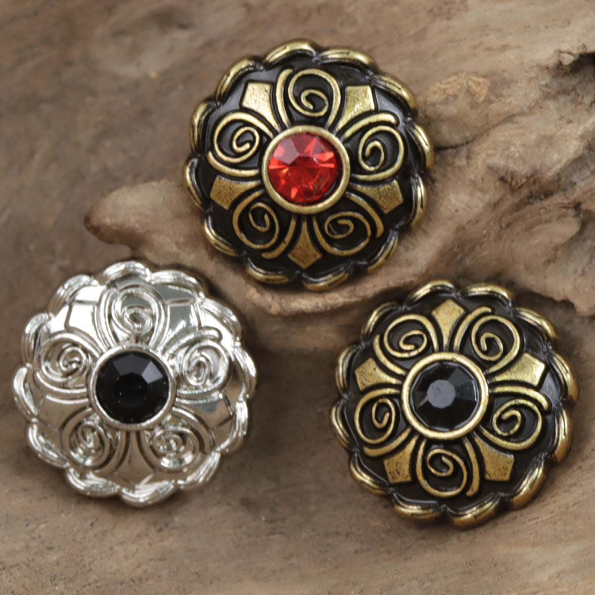 Antique coat buttons with red and black center stones in ornate filigree settings