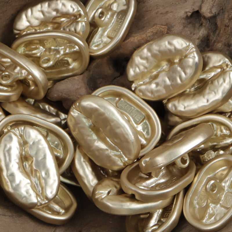 Bronze and gold-toned distressed coffee bean metal buttons, oval fronts and loop backs