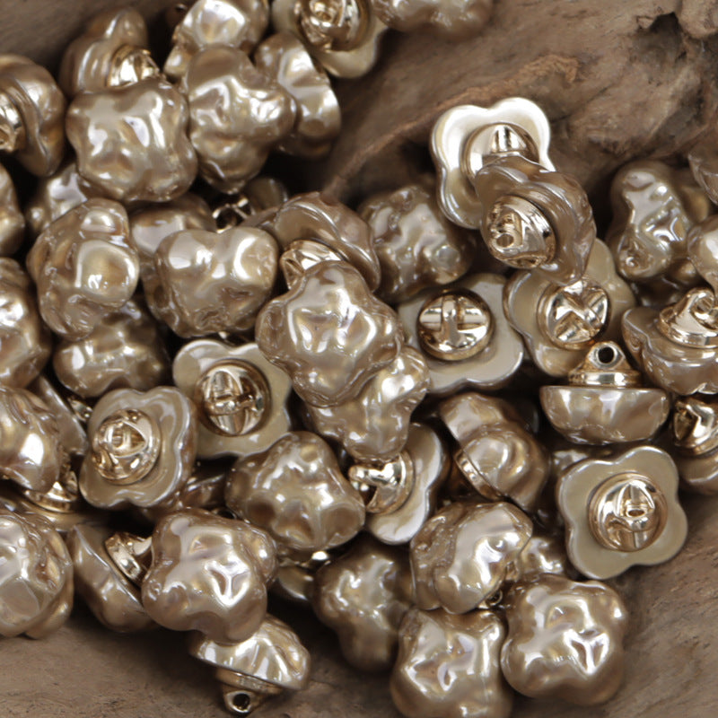 Gold-toned cloud resin buttons with gold metal shanks
