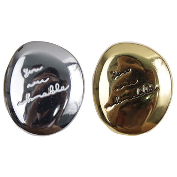 Shiny irregular oval metal buttons set: gold and dark-silver faces with small decorative lines