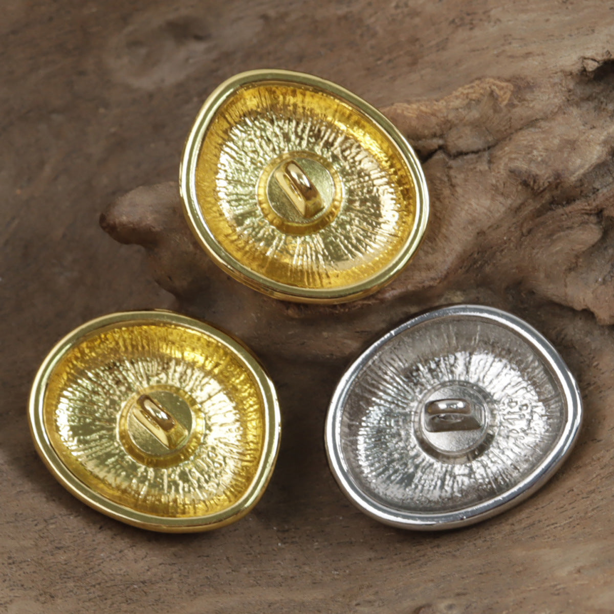 Irregular oval metal buttons (backs), shiny gold and silver finishes with metal loops