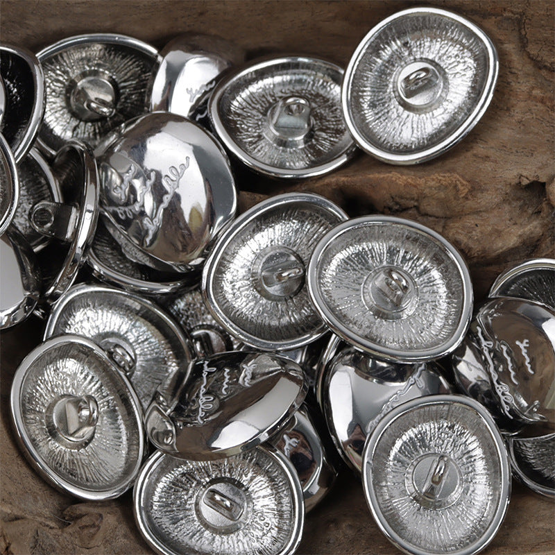 Shiny irregular oval metal buttons, silver fronts/backs with central loop openings