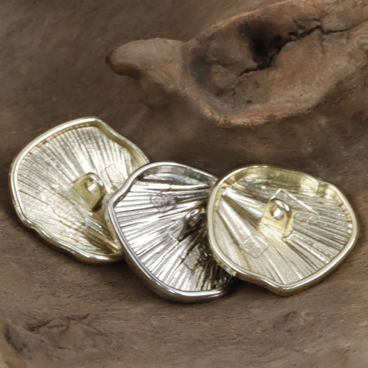 Ginkgo fan-shaped metal buttons in gold and silver finishes, metal shanks visible