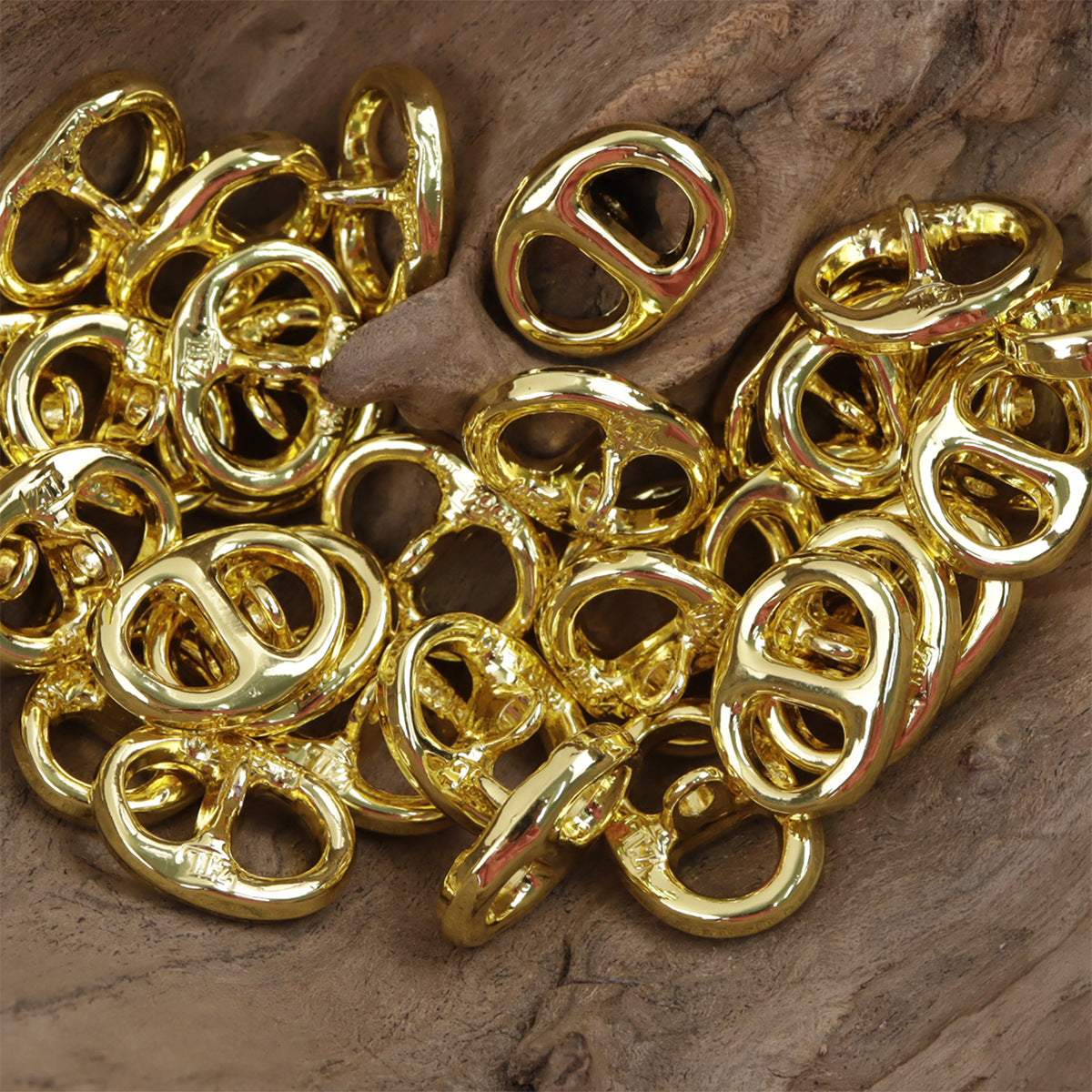 Set of gold pig nose-shaped metal buttons with visible shanks, 10pcs