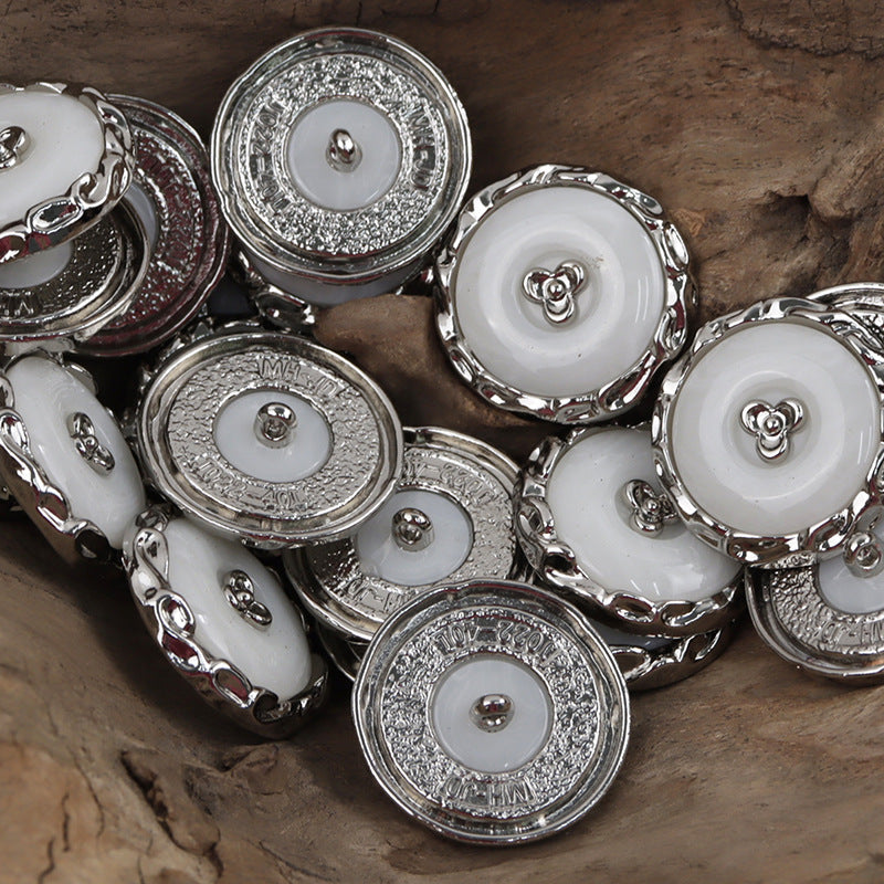 Silver resin-metal shamrock buttons with white centers and raised clover detail