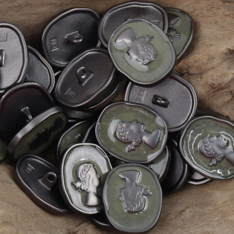 Dark green metal decorative button with shank, painted girl relief cameo