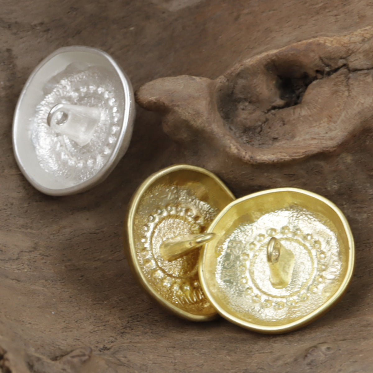 Gold and silver metal buttons with white pearls and decorative raised edges