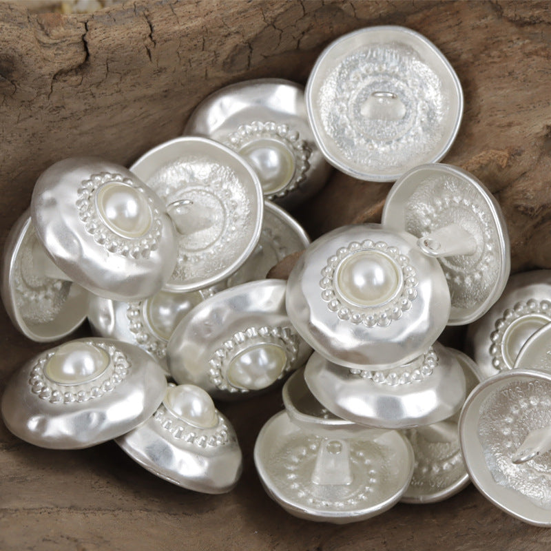 Silver metal buttons with white pearl centers, round scalloped border detailing