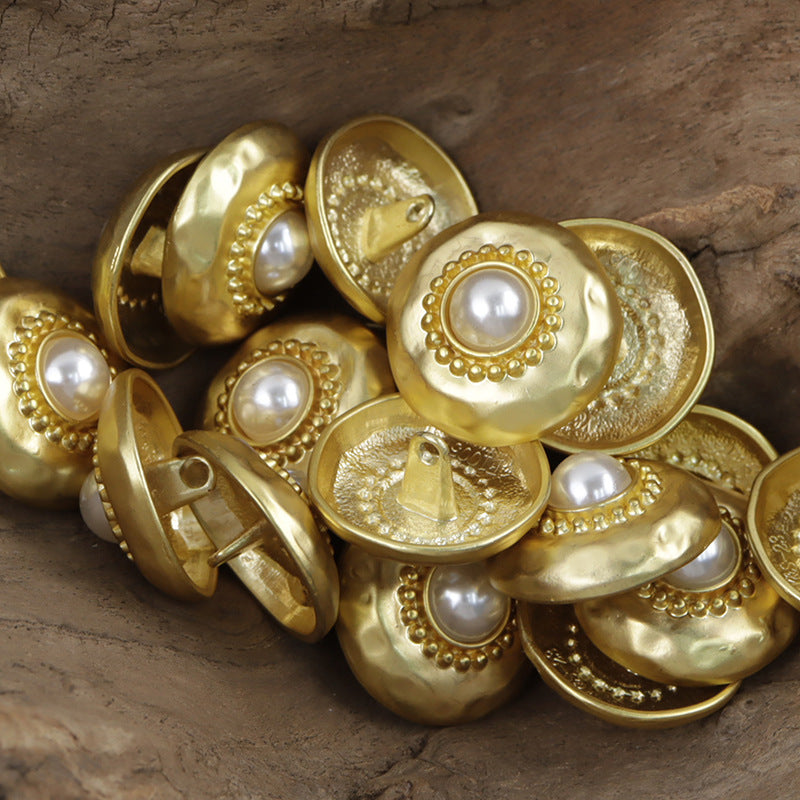 Gold metal buttons with white pearl centers, round decorative scalloped border