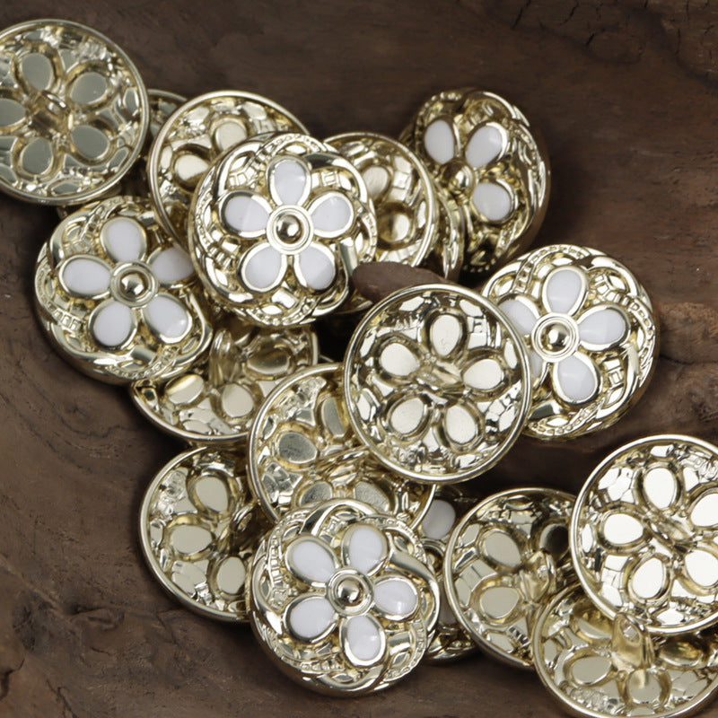 Gold-tone daisy metal buttons with white enamel petals and round center stud