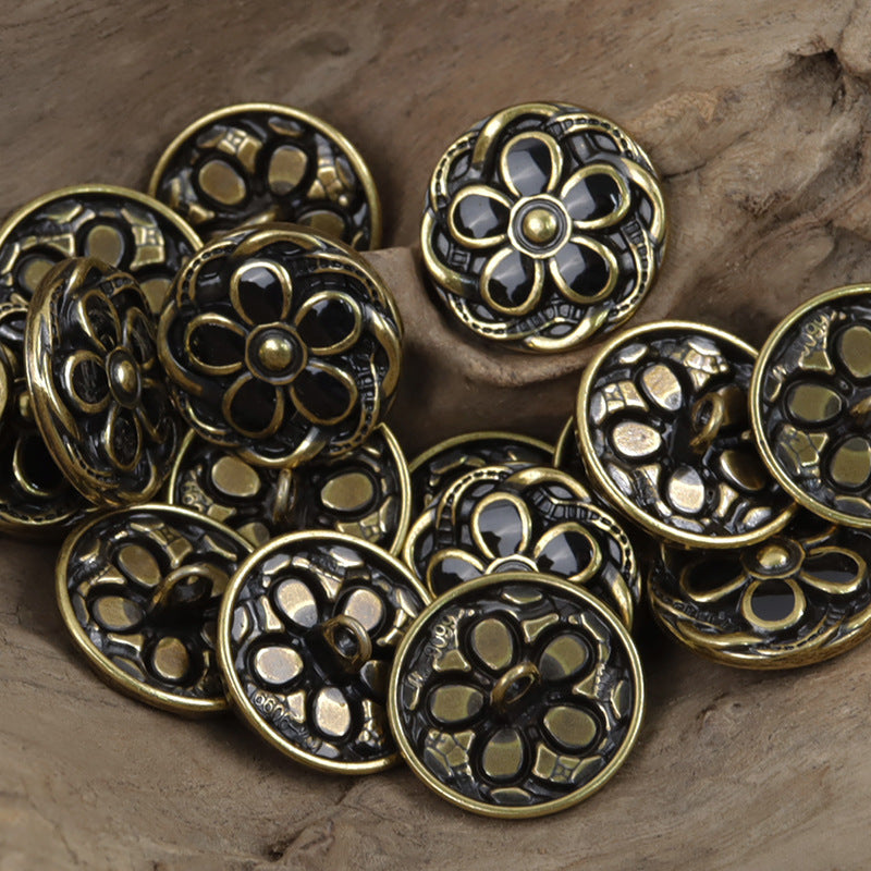 Black-gold tone daisy metal buttons with engraved petals and central stud