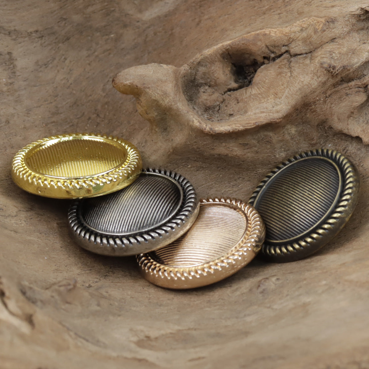 Round vintage striped metal buttons with shank, ridged border, mixed finishes, front view