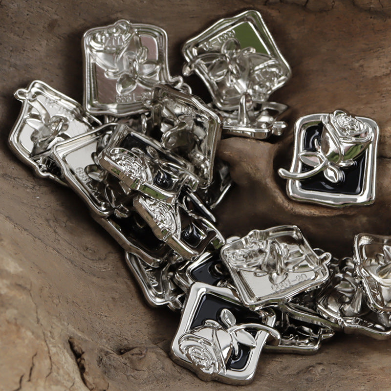 Square black and silver rose metal shank buttons, shiny metal loop shank