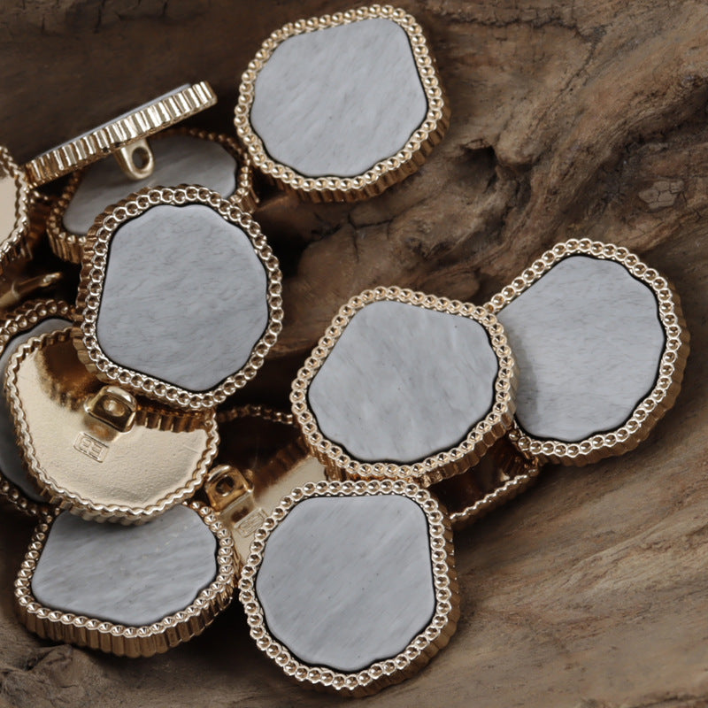 Marble-look resin metal shank buttons, light gray and white fronts with scalloped metal edge.
