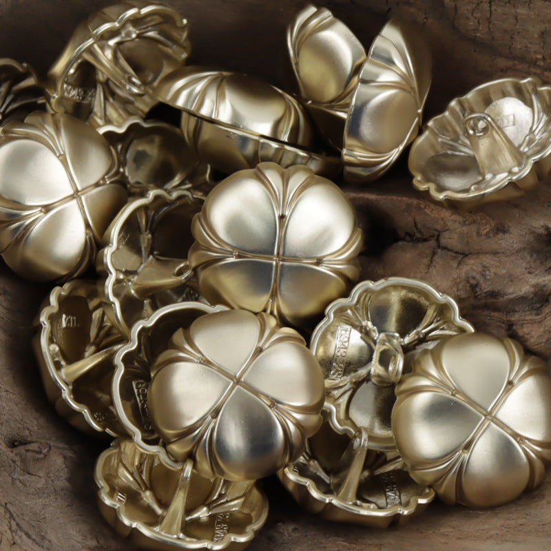 Assorted four-leaf clover metal shank buttons in gold and silver finishes, mixed pack