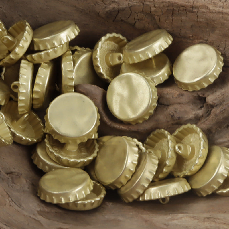 Gold bottle cap metal buttons with loop backs, round faces and raised center