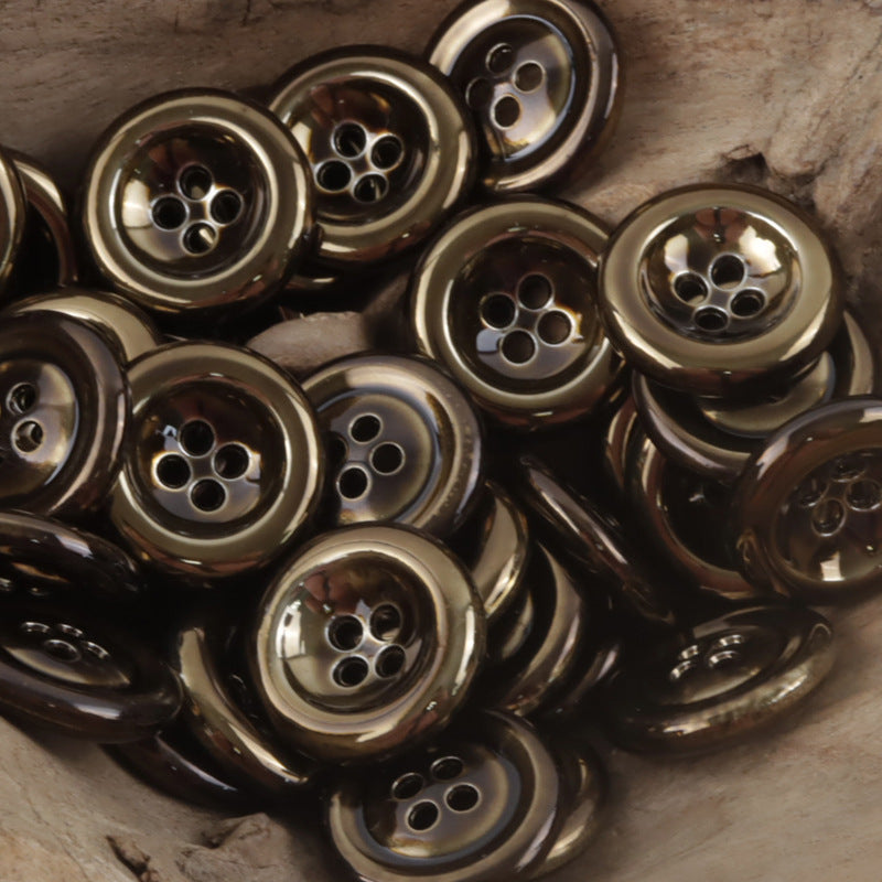 Vintage dark silver 4-hole double-sided metal buttons, multiple buttons close-up