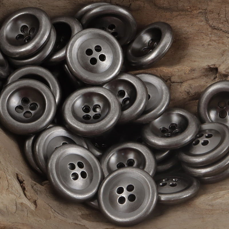 Vintage silver 4-hole double-sided metal buttons, matte metallic finish (close-up)