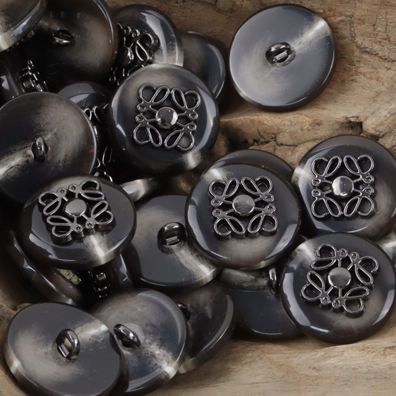 Black resin coat buttons with silver-tone butterfly metal pattern, shank back