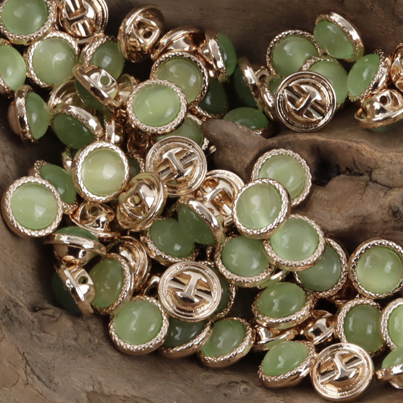 Assorted pearlescent metal buttons with light green front stones, round 11.5mm, silver-tone borders