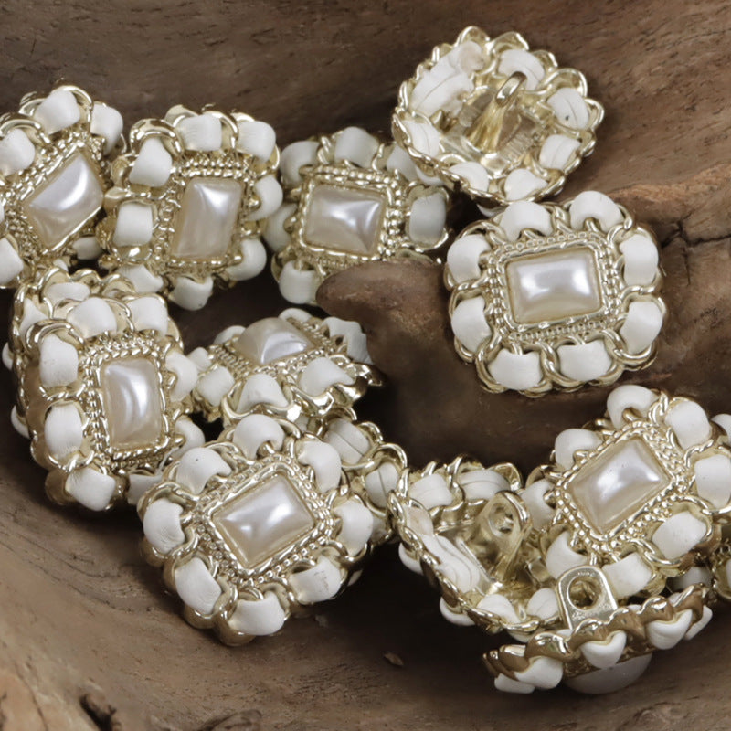 Champagne square metal pearl buttons with leather cord weaving, close-up
