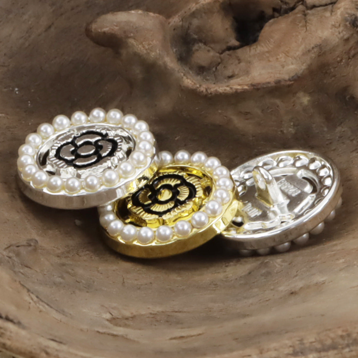 Pearl-trim black rose buttons with floral metal cores, gold and silver
