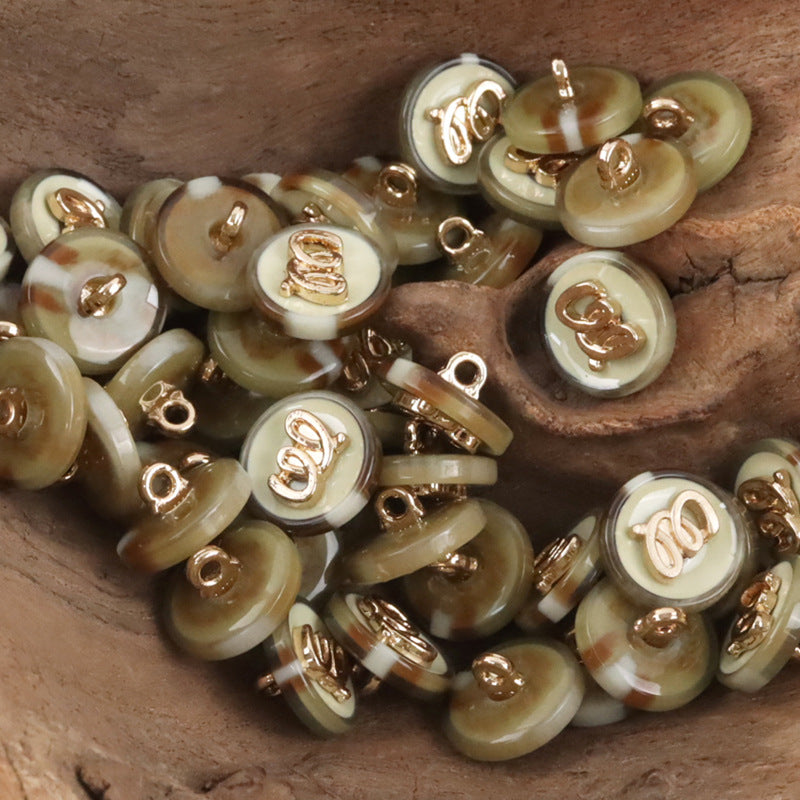 Retro Resin-Knöpfe, viele rund; goldene Ösen; transparente Farben in beige/braun/grün