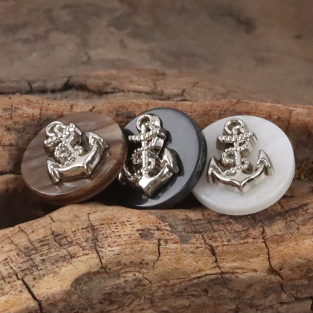 Resin buttons with silver anchor motif in brown, dark, and white (3 buttons)