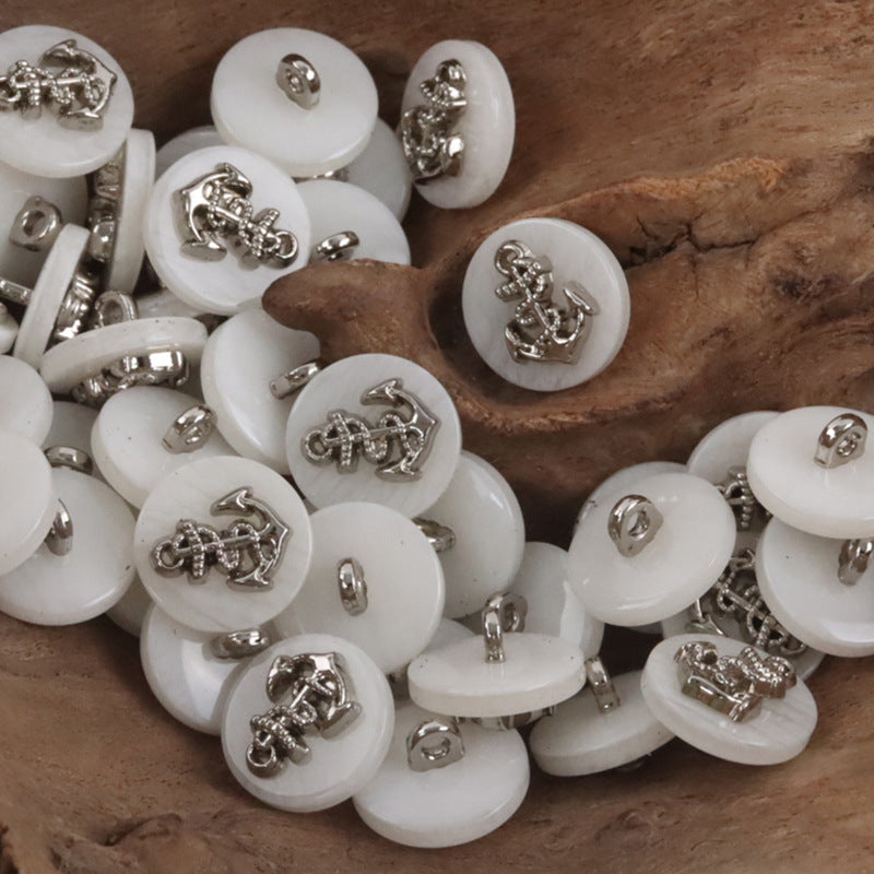 Resin buttons with silver anchor motif, white—multiple pieces shown