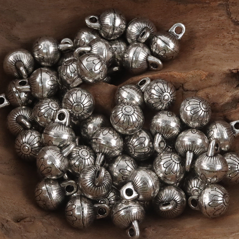 Silver metal high-foot shank buttons, round floral emboss with loop shank holes