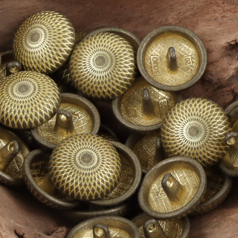 Gold-tone round shank metal buttons with geometric pattern and circular center design