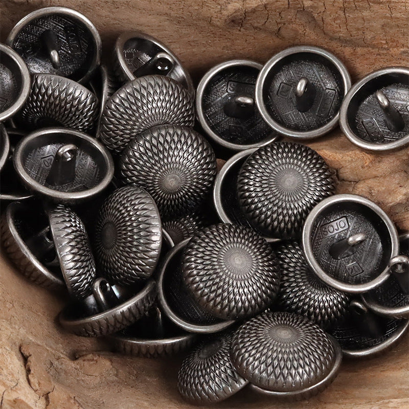 Silver and black geometric round shank metal buttons, round faces with center medallion