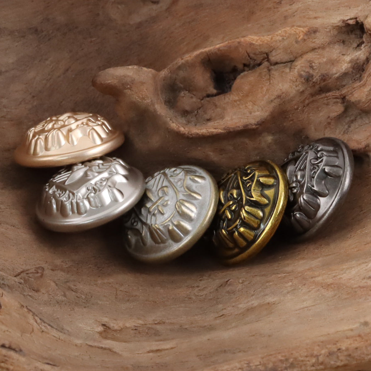 Rose gold, silver, bronze and dark metal shank buttons with shield-sword crest