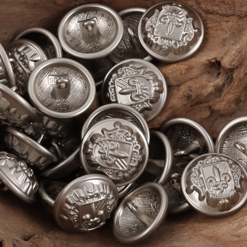 Nickel-silver metal shank buttons with shield-sword fleur-de-lis crest, multiple