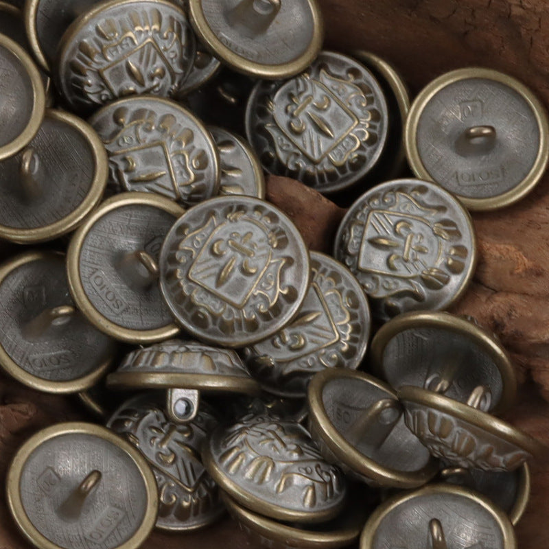 Silver and bronze-toned metal shank buttons with shield-sword crest, assorted