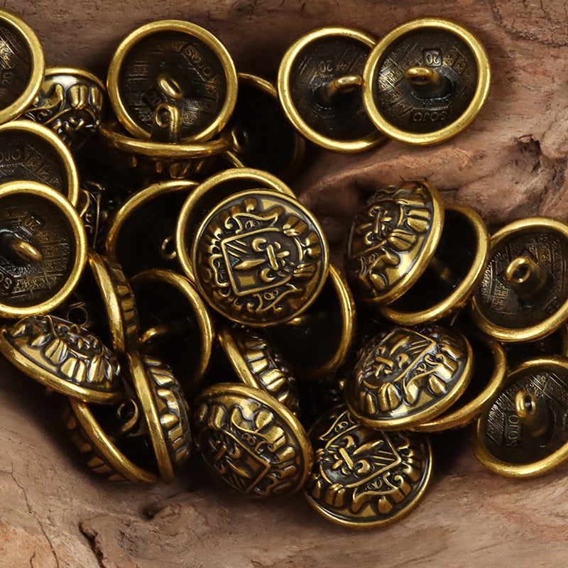 Bronze/gold metal shank buttons with shield-sword fleur-de-lis crest, multiple