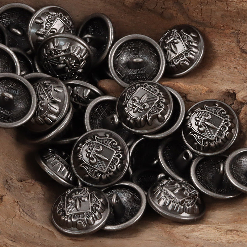 Black and silver metal shank buttons with shield-sword fleur-de-lis crest, assorted
