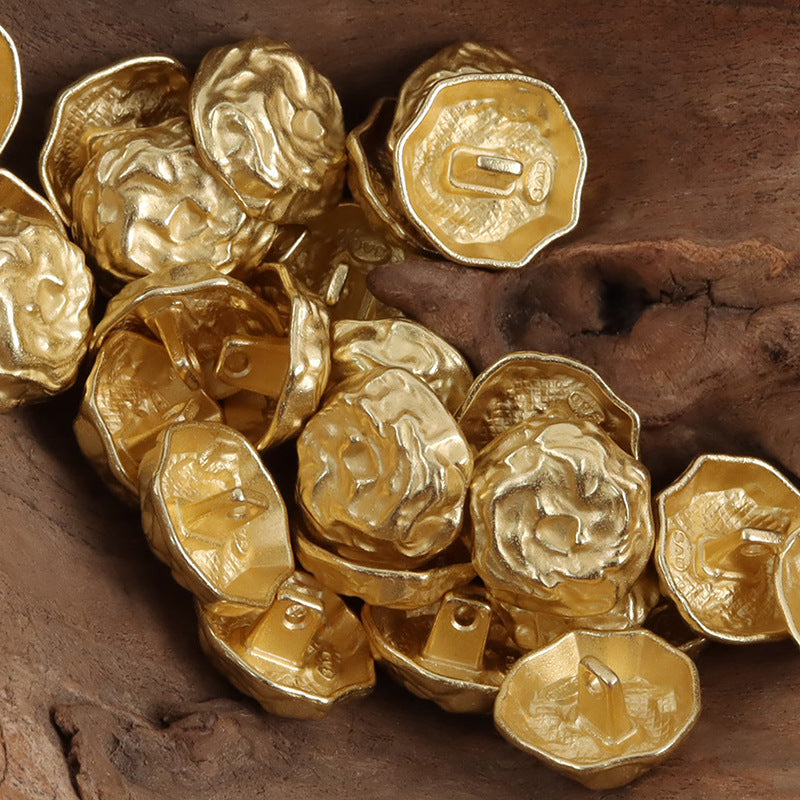 Golden Egyptian-style rock metal buttons, multiple pieces with raised pattern and shanks