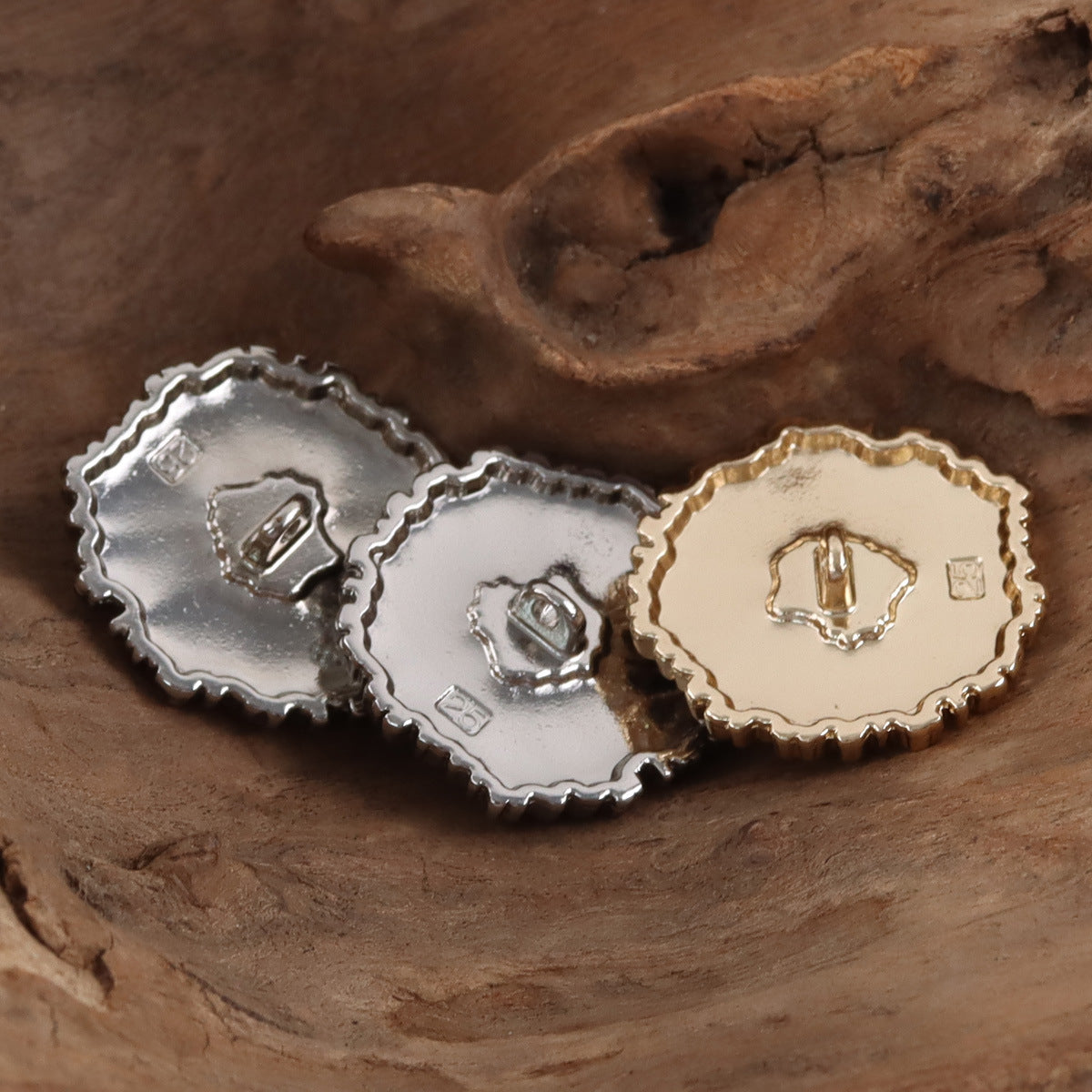Black-centered snowflake buttons, silver and gold backs with shanks