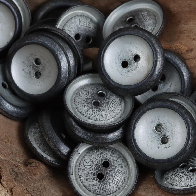 Assorted distressed metal buttons in dark and antique silver tones, two holes each