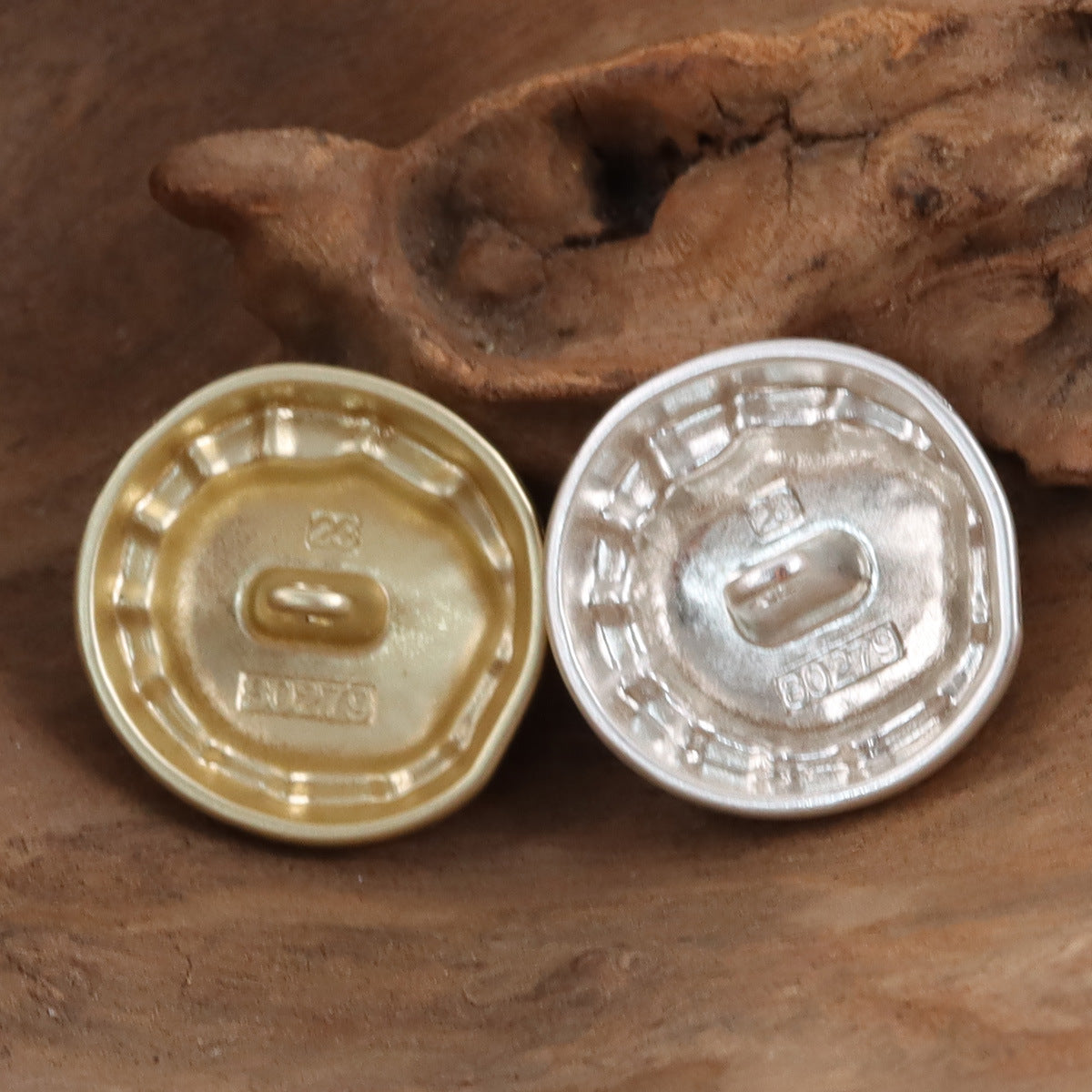 Backs of matte fashion metal buttons: gold and silver with loop shanks, 2 pieces