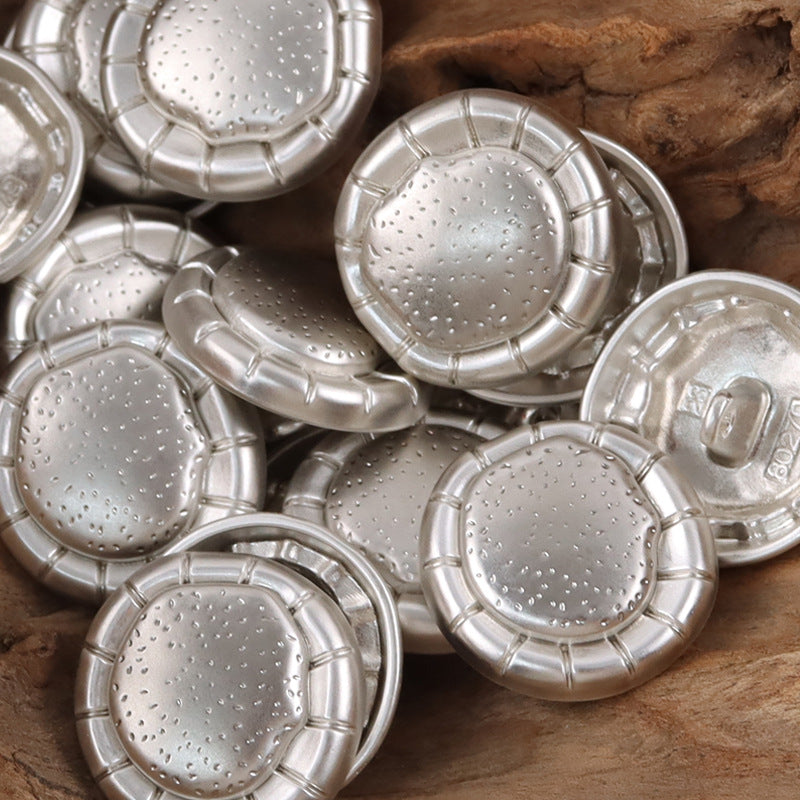 Set of matte silver fashion metal buttons with studded round fronts and ring shanks