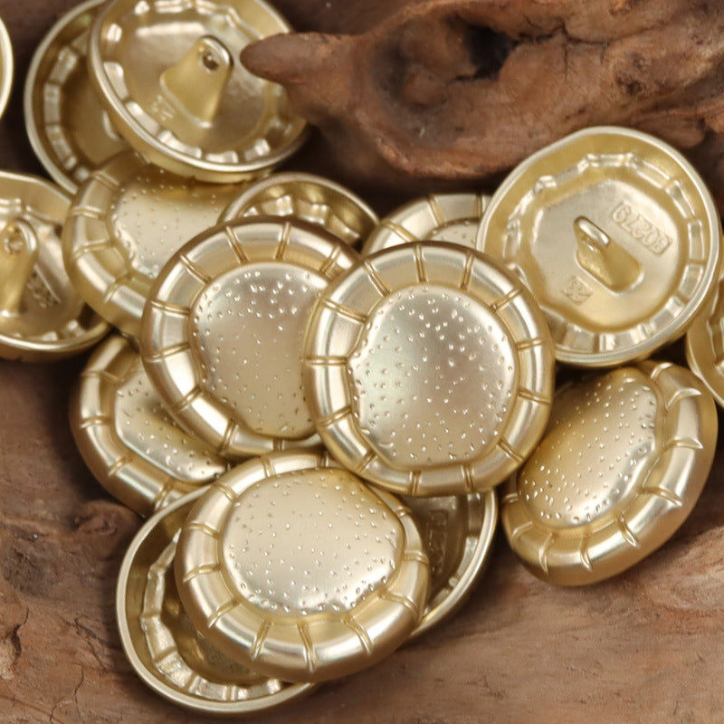 Set of matte gold fashion metal buttons with studded round fronts and loop ring shanks