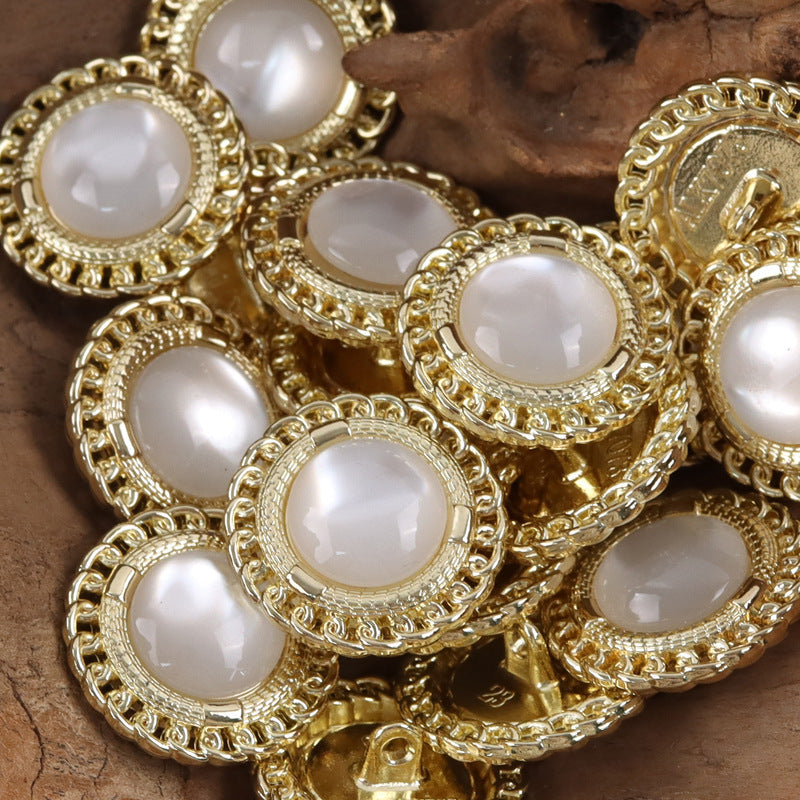 Gold-edged resin gem buttons with white round centers, decorative beaded border