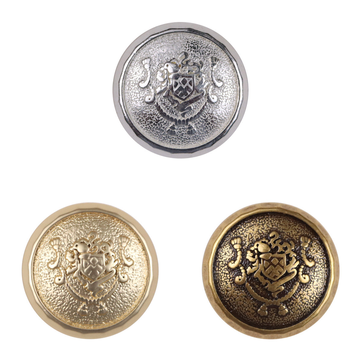 Metal shank buttons: silver and gold front with ornate crest design, 3 pcs shown