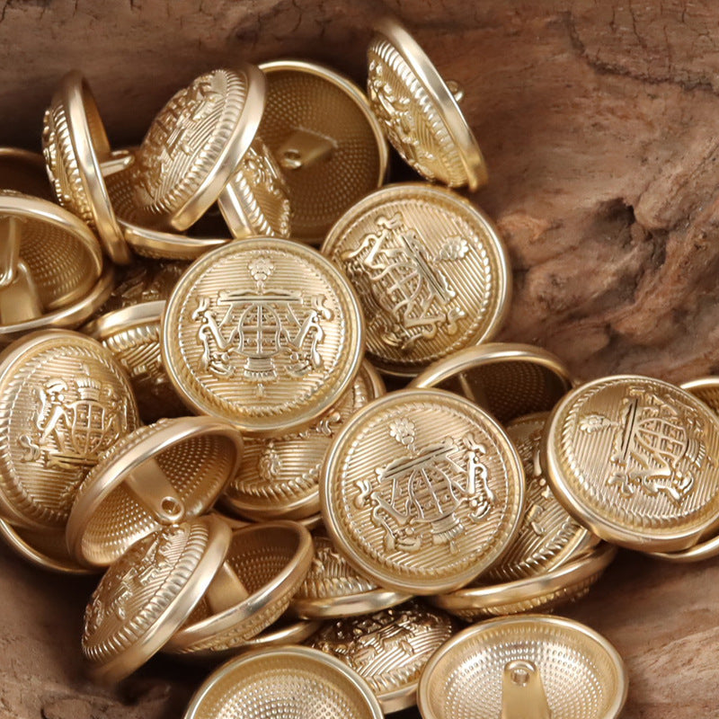 Gold metal buttons, round crown-shield emblem with visible loop backs on some pieces