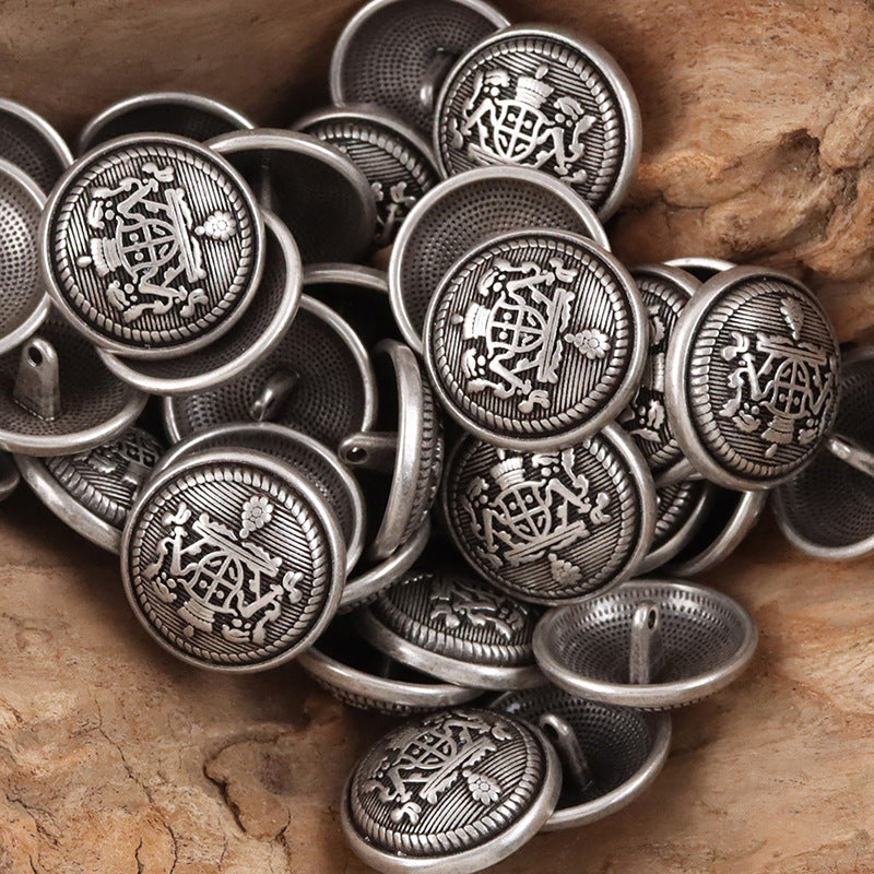 Black-silver metal buttons, round crown-shield emblem with ridged rim and loop backs