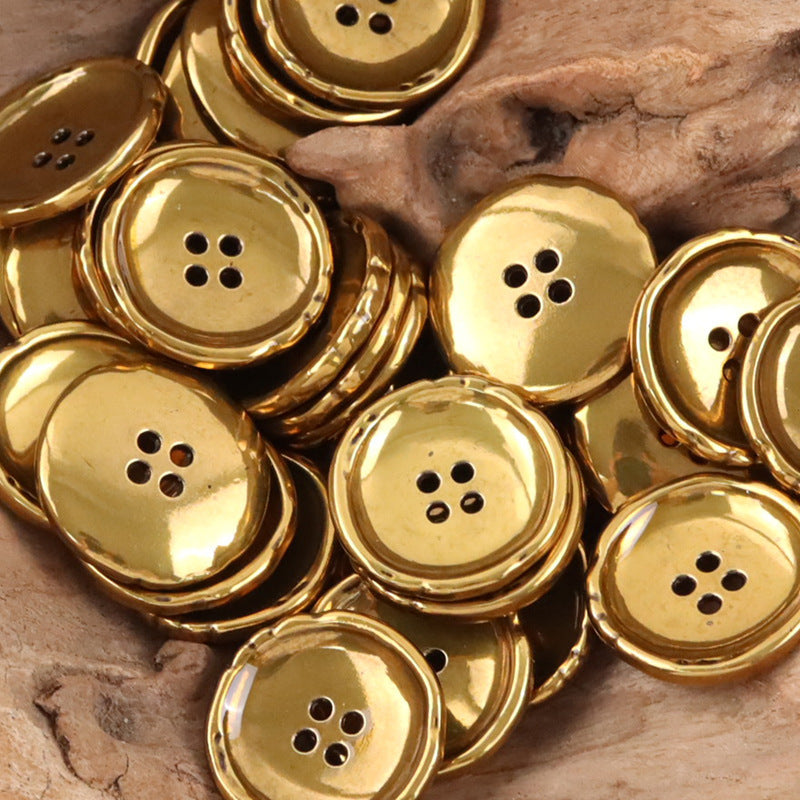 Pack of irregular round metal buttons in gold, each with 4-hole shank.