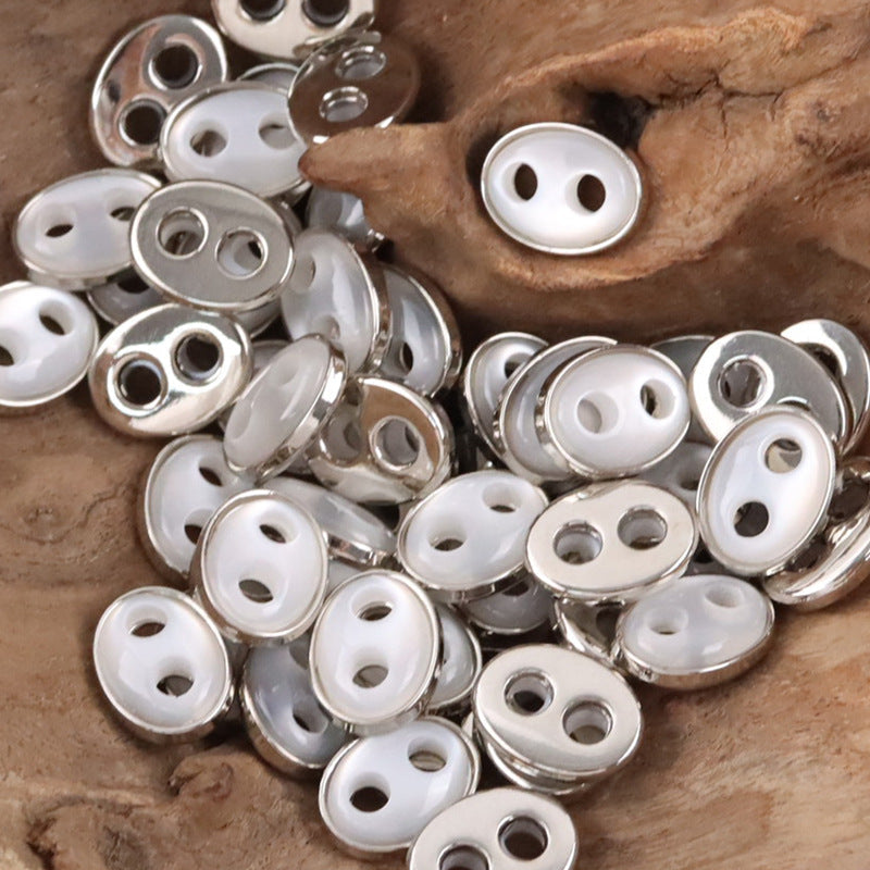 Pig nose resin buttons: white faces with silver-tone metal rims, oval 2-hole style